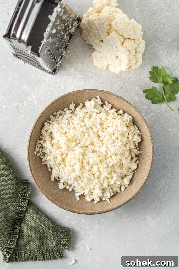 Grating cauliflower to make it rice.
