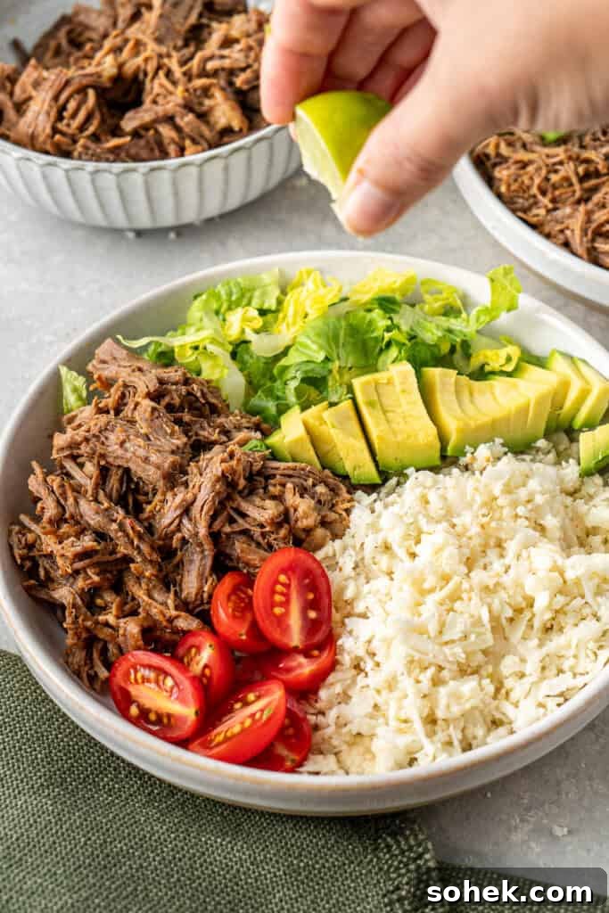 Squeezing lime over the burrito bowl.