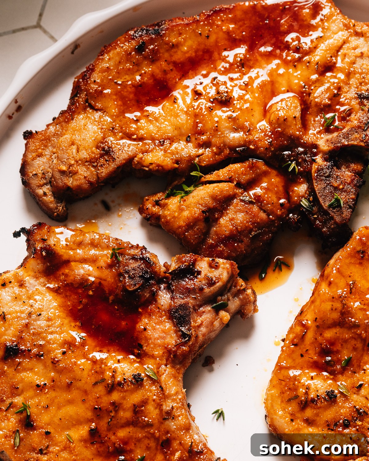 Crispy Tender Pork Chops in the Air Fryer Every Time 10 Air fryer pork chops on a plate close up.