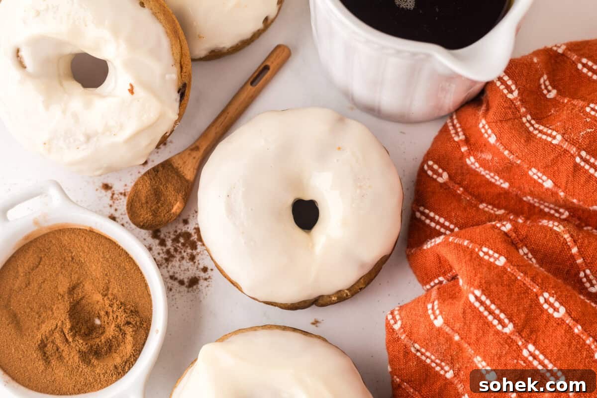 Maple-Glazed Donuts: Homemade Recipe and Serving Tips 3 maple donut surrounded by ground cinnamon and maple syrup