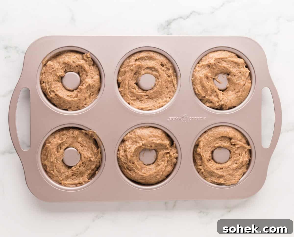 Maple-Glazed Donuts: Homemade Recipe and Serving Tips 9 Maple donut batter in donut mold