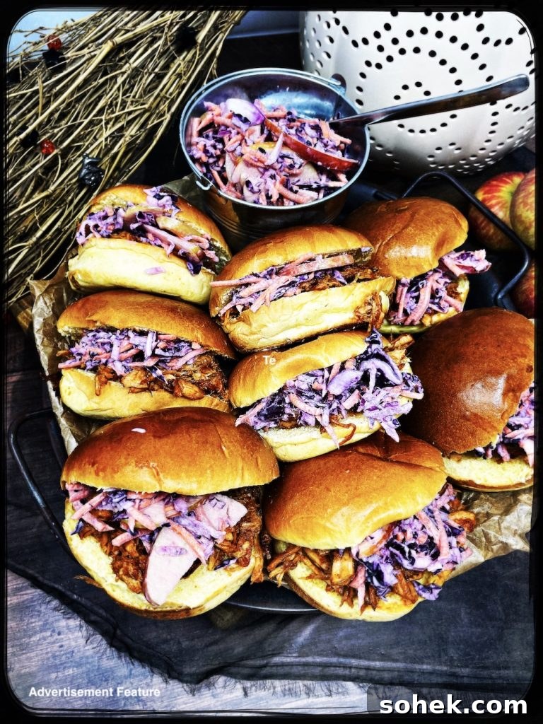 Smoky Pulled Pork for Bonfire Night Recipes 10 Homemade smoky pulled pork with homemade coleslaw stuffed into brioche rolls on a serving tray ready to grab and go
