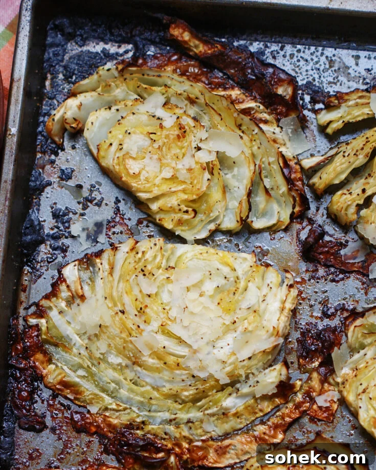 close up of beefy roasted cabbage steaks to show caramelization and seasoningsd