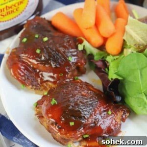 Slow Cooker BBQ Chicken Thighs in a white plate