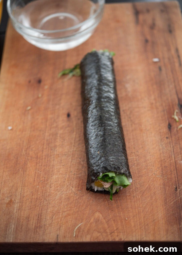 Finished tuna cucumber kimbap roll before slicing