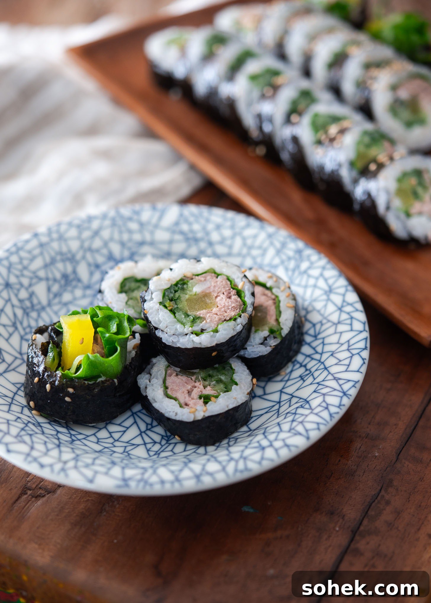 A few sliced tuna rice rolls served on a plate