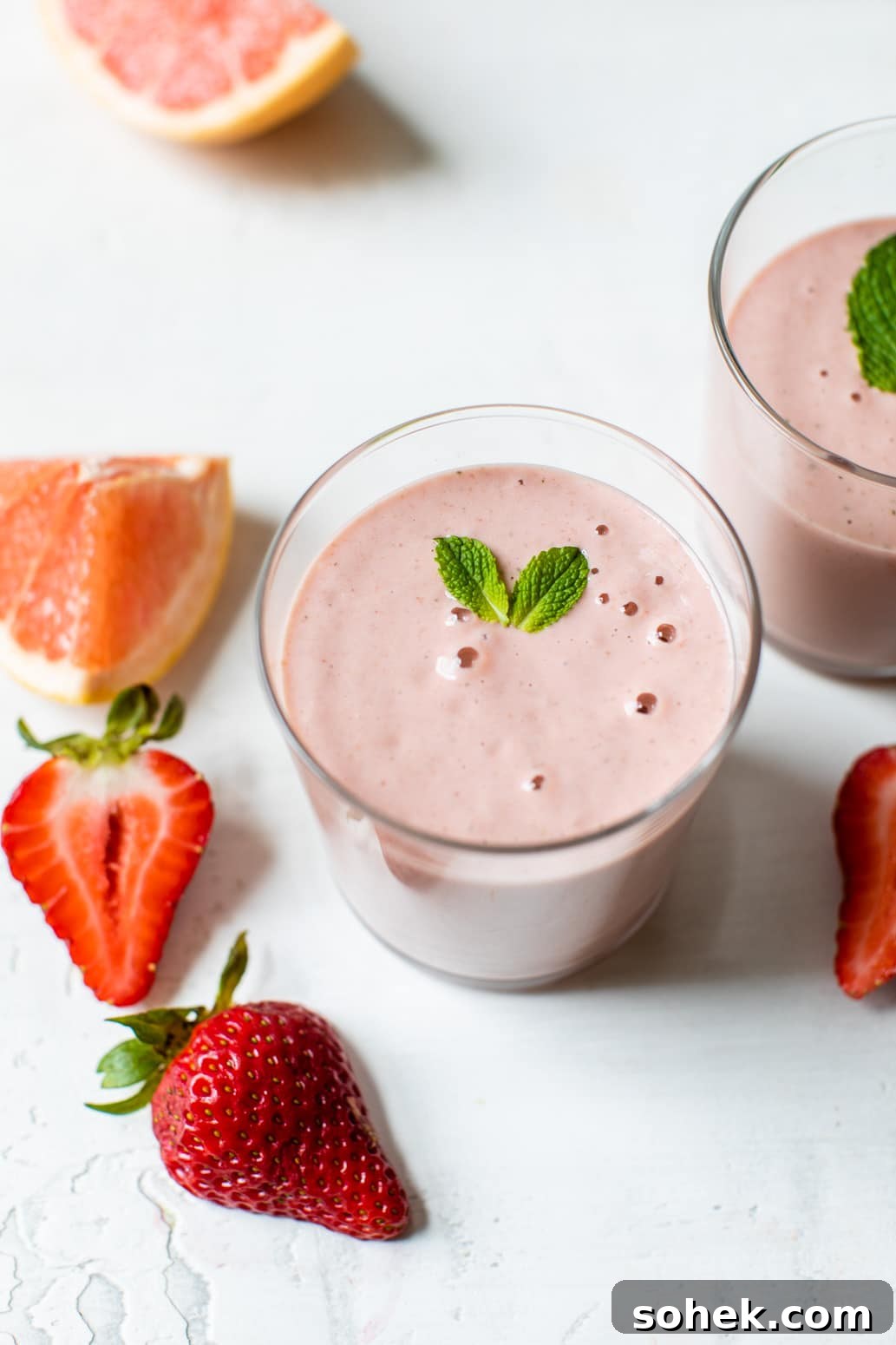 pink smoothie topped with fresh mint