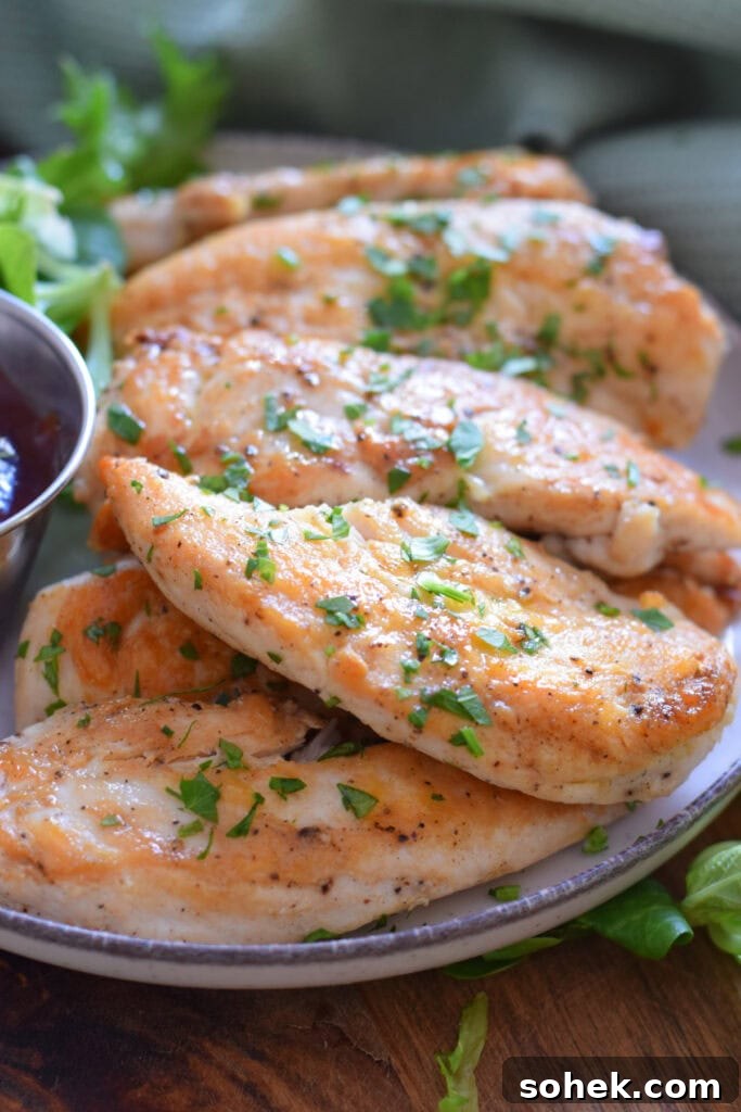 Close up of chicken tenders on a plate.