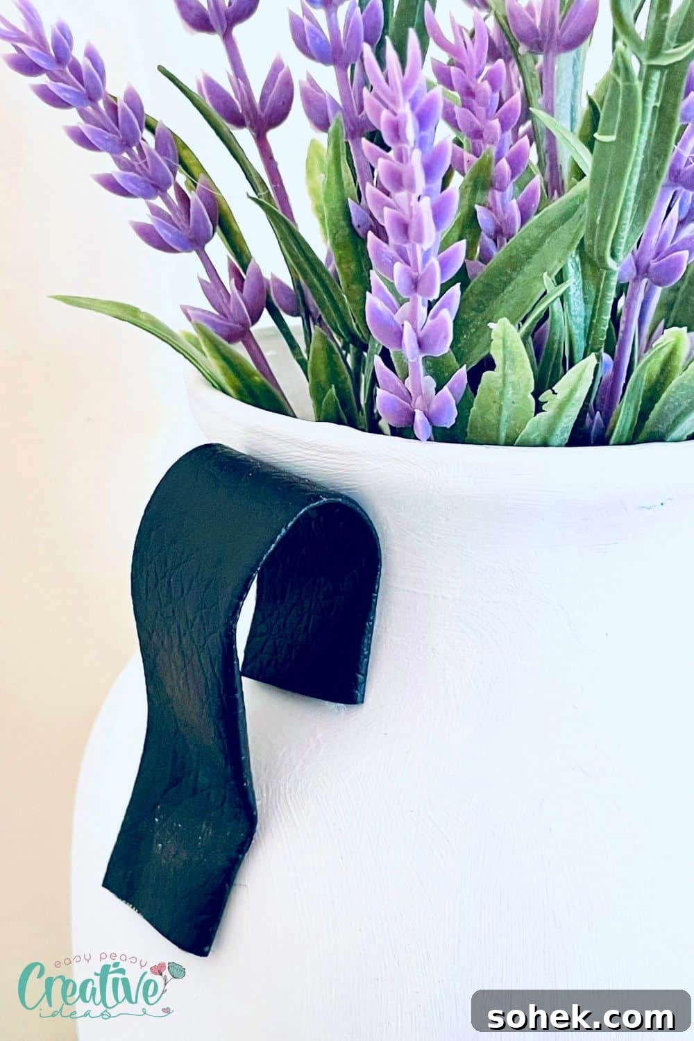 DIY Vase Inspired by Pottery Barn: Stylish, Budget-Friendly Project 4 Close up image of a faux leather handle on a Dollar Tree vase DIY