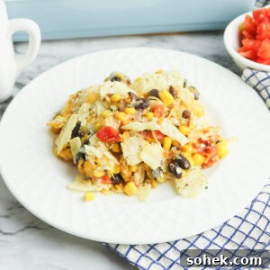 A serving of Mexican Chicken Casserole on a white plate.