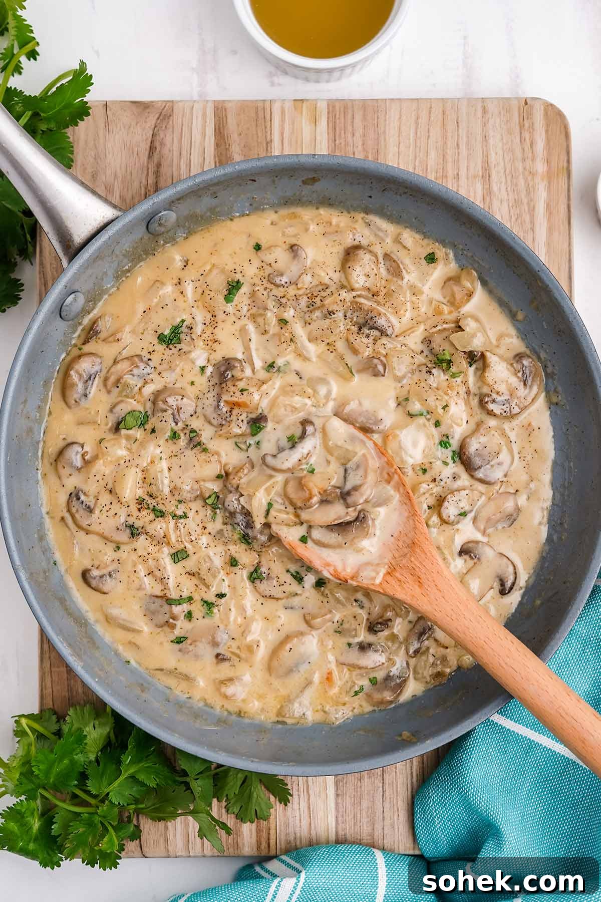 White mushroom sauce with cream on the table ready to serve.