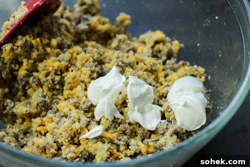 Sausage ball mixture in a large glass bowl