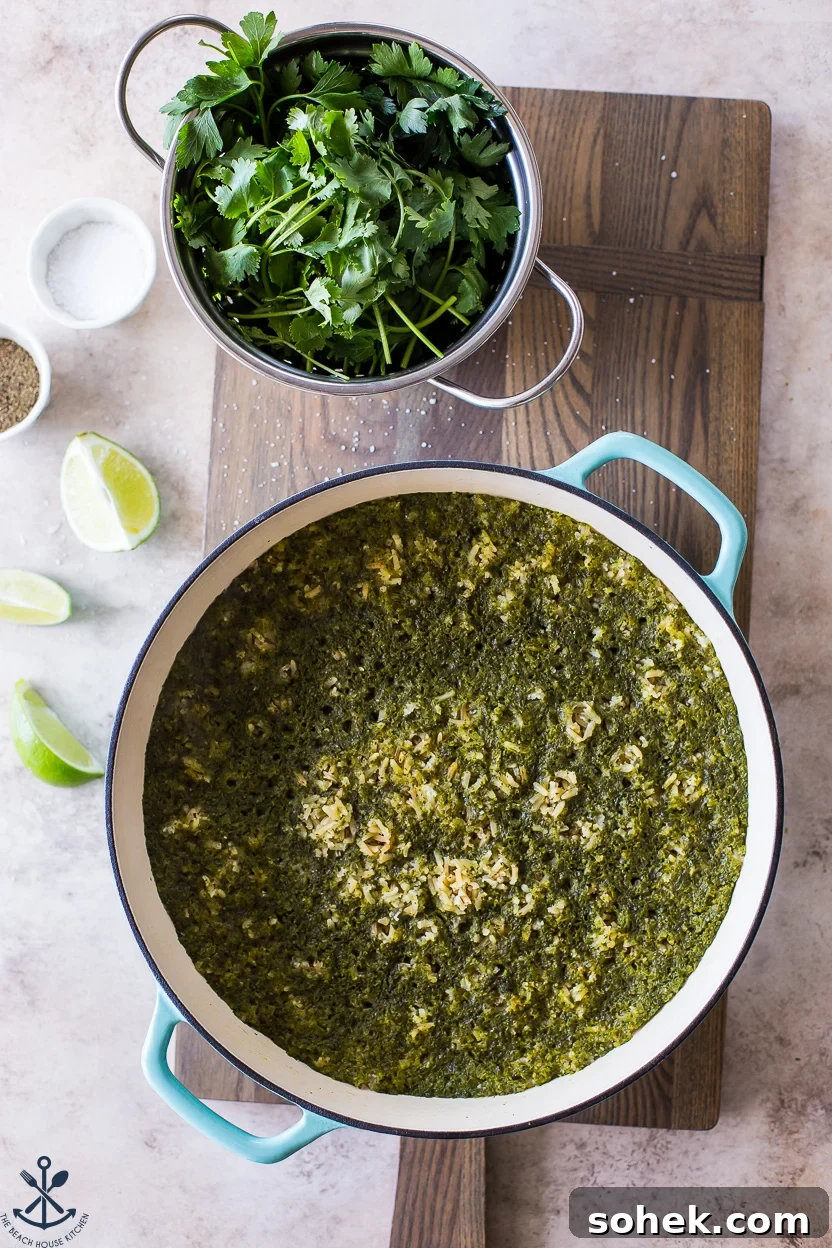 Overhead photo of a skillet of green rice