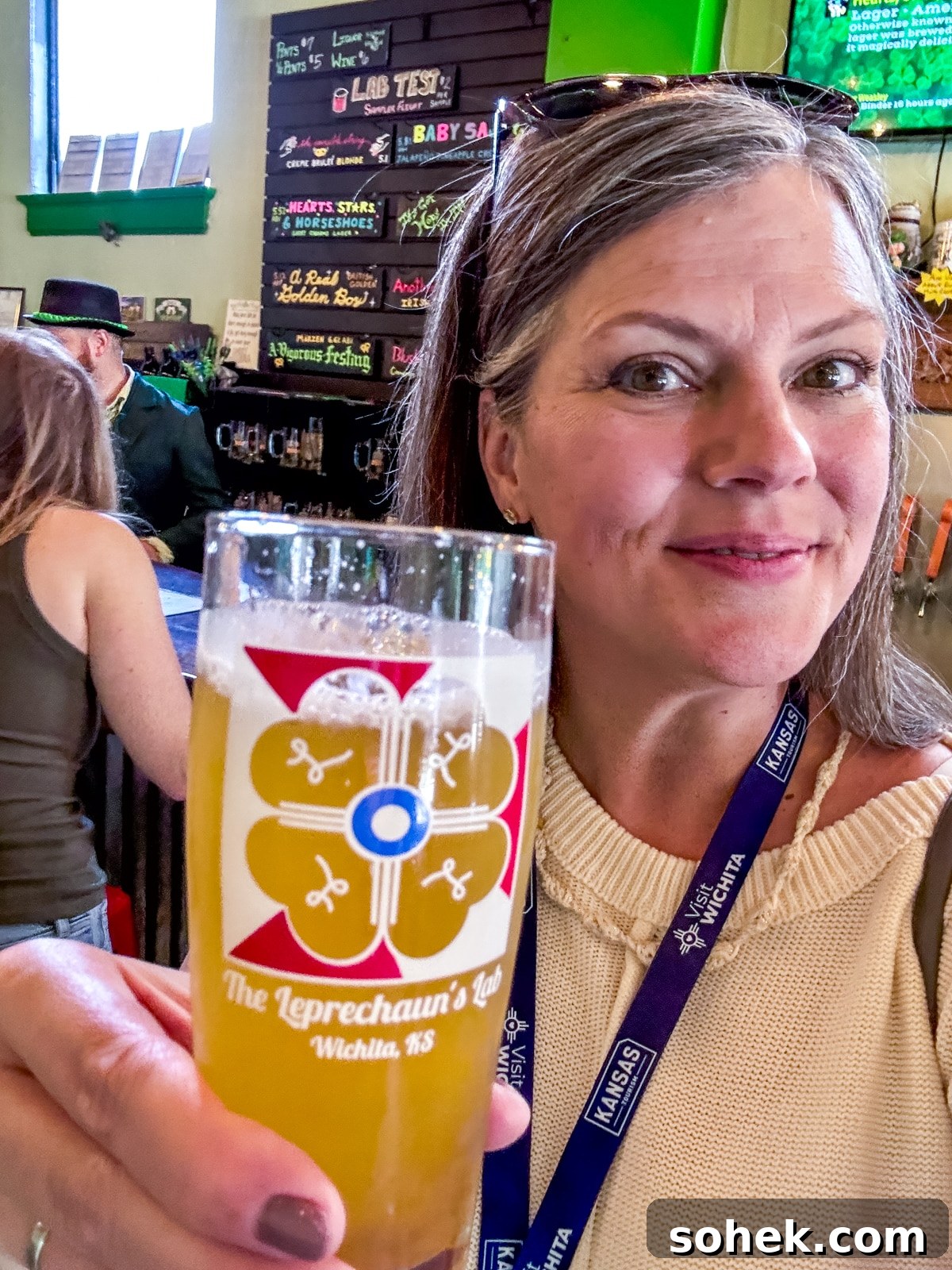 Discover Wichita, Kansas: Must-See Sights and Local Gems 4 A woman holding a glass of beer labeled