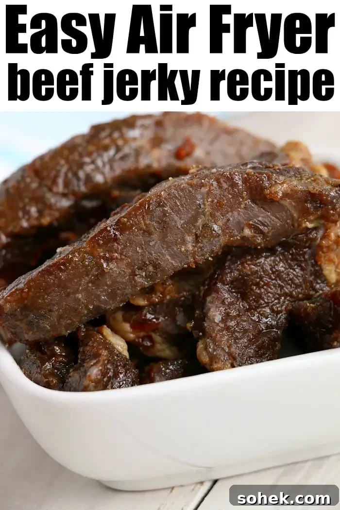 Crispy Air Fryer Beef Jerky Recipe for Homemade Snacks 7 A close-up of a white bowl filled with pieces of dark brown beef jerky.