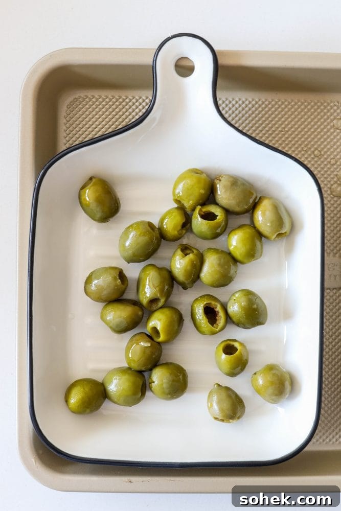Mediterranean Baked Olives with Feta and Herbs 5 pictures of olives in a baking dish