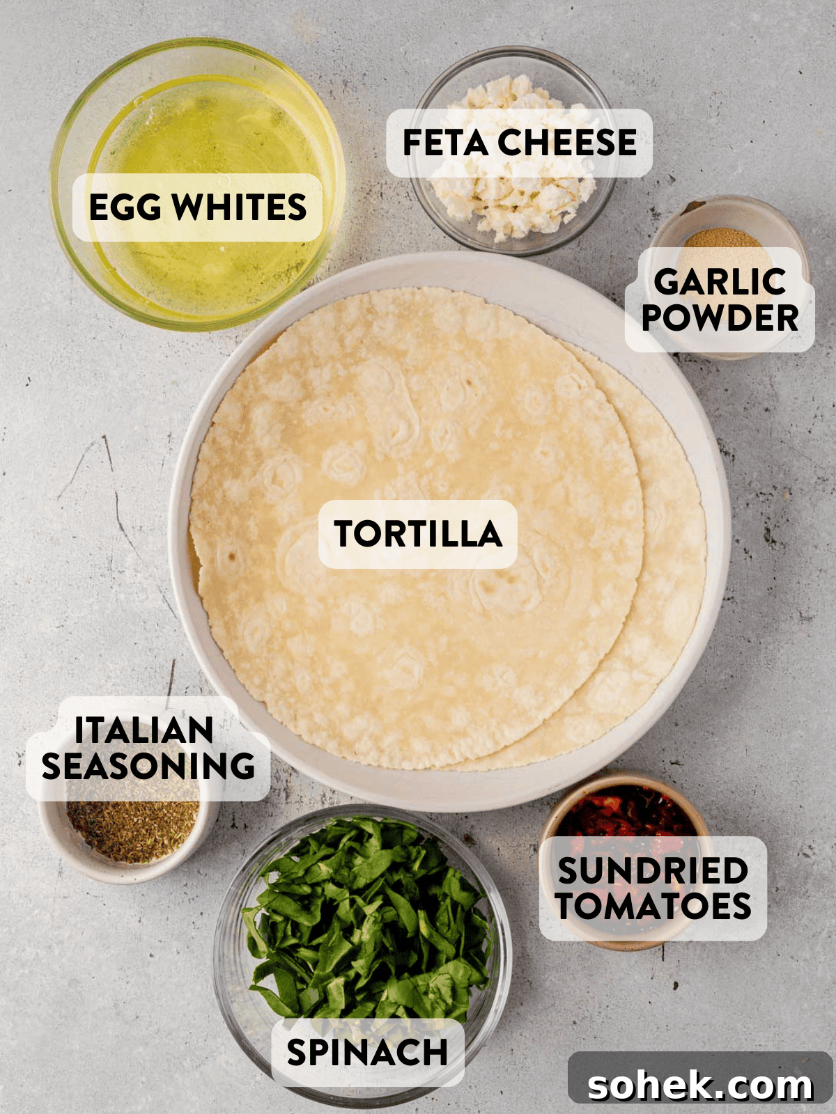 Spinach and Feta Egg White Wrap Recipe for Protein-Packed Breakfast 3 spinach feta egg white wrap ingredients on a counter top.