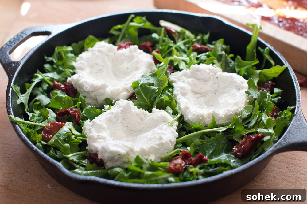 Baked Eggs with Ricotta, Greens & Sun Dried Tomatoes ricotta clouds ricotta clouds
