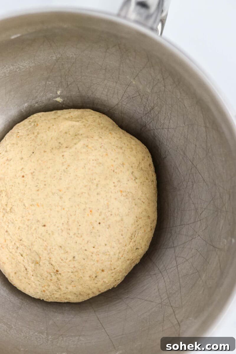 Rye bread dough in a metal bowl.