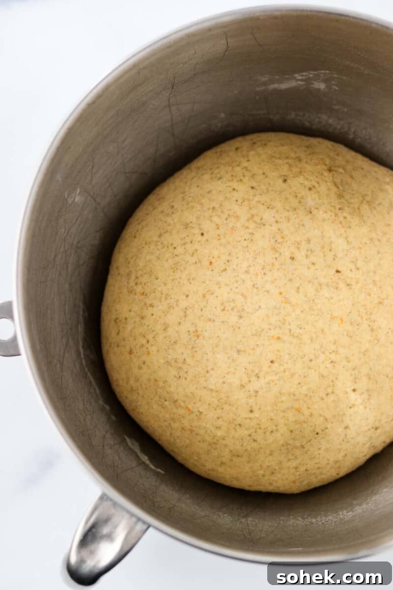 Rye bread dough in a metal bowl.