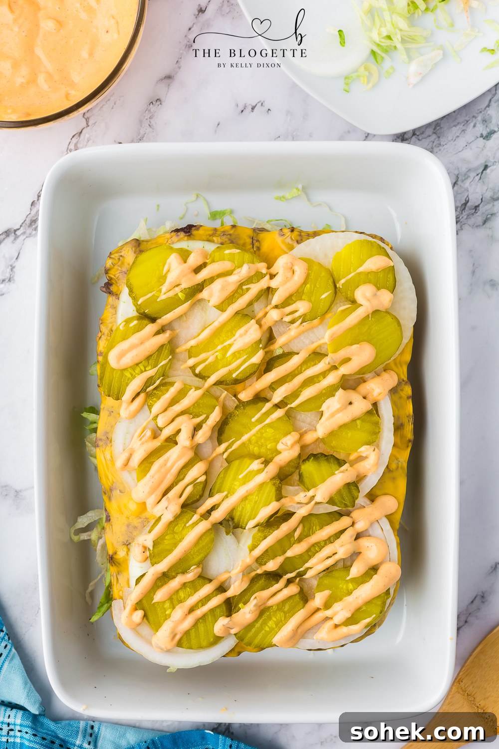 Pickles and sauce drizzle