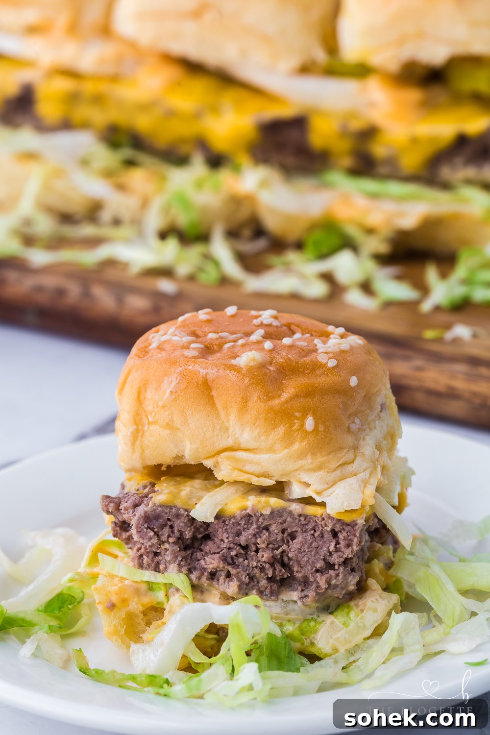 Big Mac Sliders are the miniature version of your favorite fast food burger! Juicy little hamburgers with pickles, onions, lettuce, the "secret sauce", and then surrounded by buttery buns.