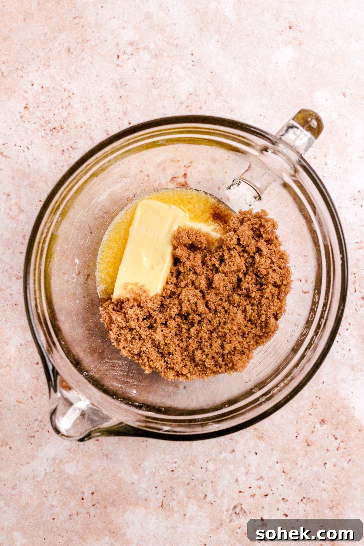Cinnamon Chocolate Chip Cookie Recipe — Warm, Spiced Chocolate Treat 5 A glass bowl of butter and brown sugar.