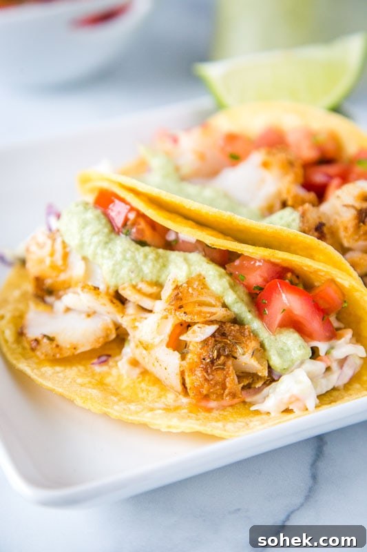 lightly seasoned cod in corn tortillas with pico de gallo and cabbage