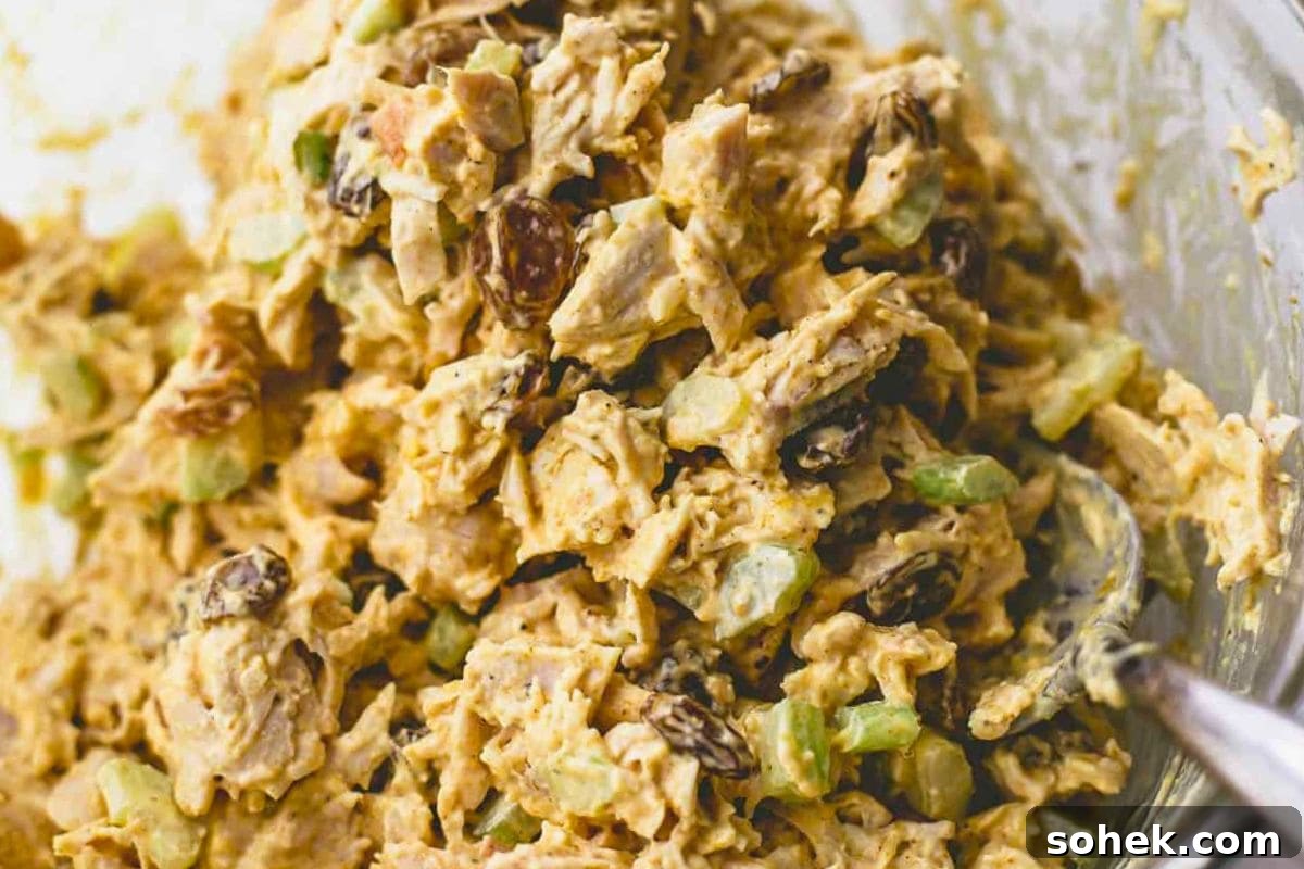 Curried leftover turkey salad served on a plate.