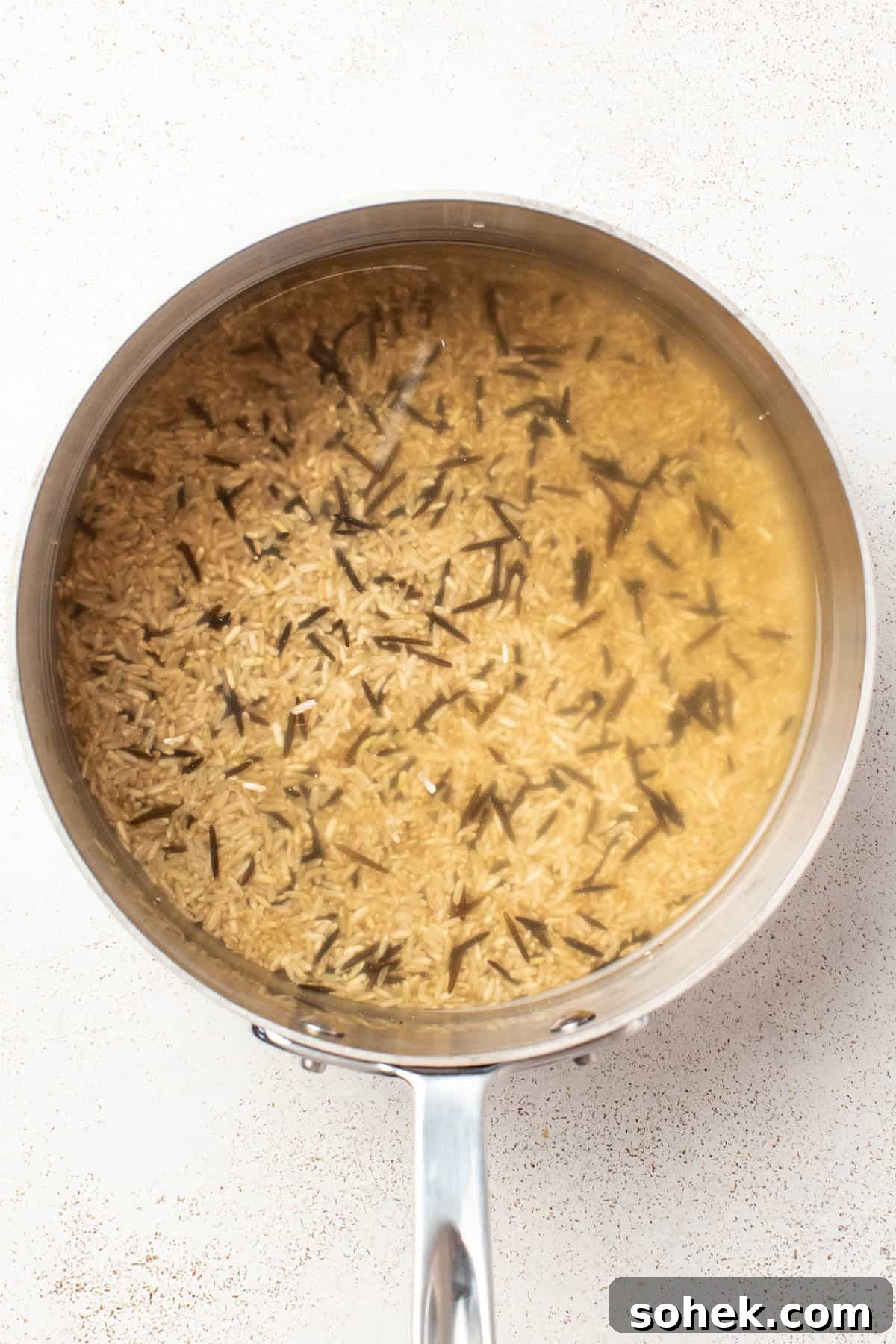 Dijon Chicken Skillet with Wild Rice and Veggies 4 Cooked wild rice blend in a pan.