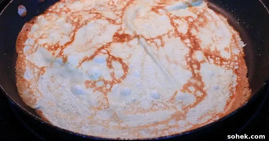 Classic French Crepes: Thin Pancake Recipe & Serving Ideas 12 baking the other side of crepe