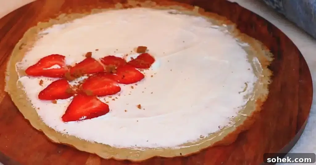 Classic French Crepes: Thin Pancake Recipe & Serving Ideas 16 whipped cream, strawberries and crushed biscuits on a crepe