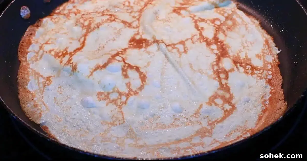 Classic French Crepes: Thin Pancake Recipe & Serving Ideas 5 baking the other side of crepe
