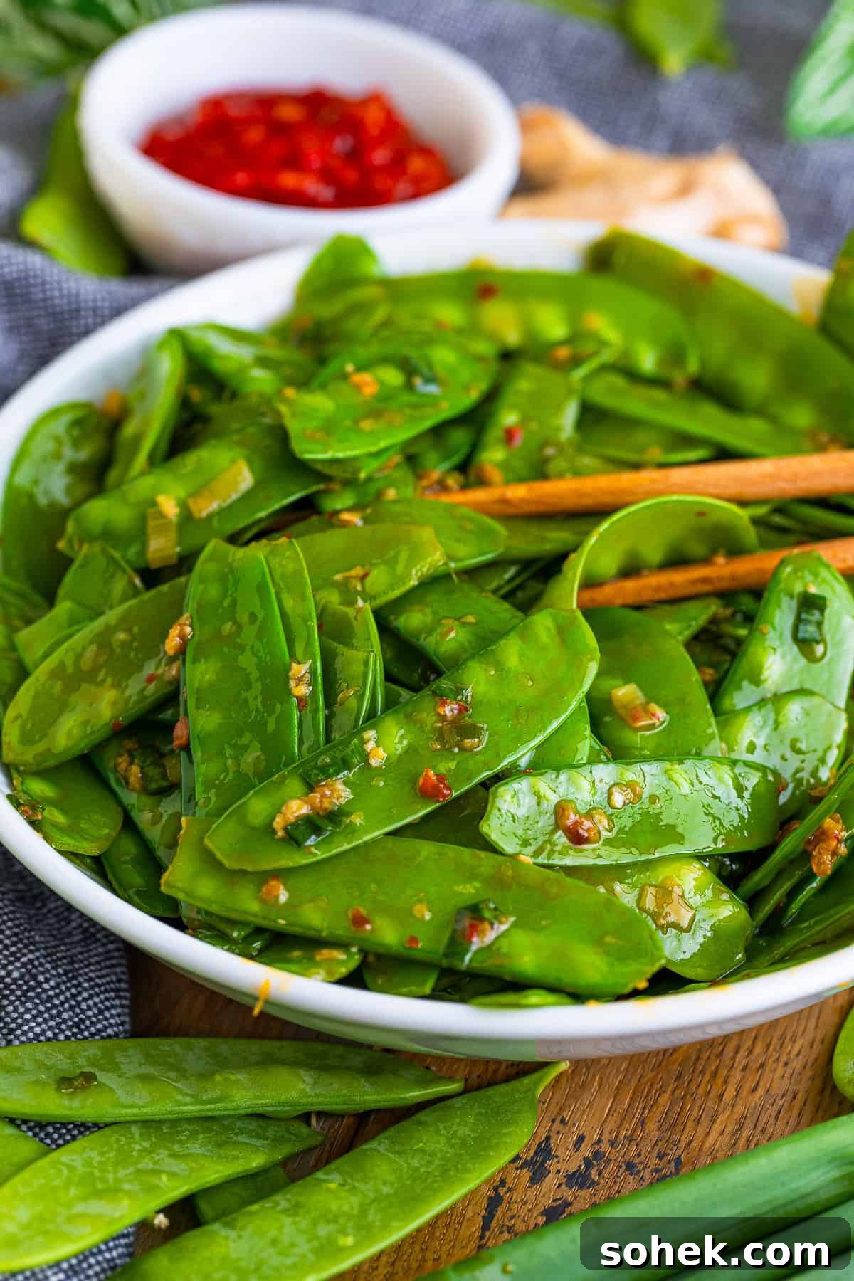 chopsticks in a bowl of snow peas recipe