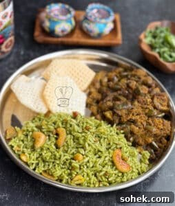 Coriander (Kothamalli) Rice Recipe — No Onion, No Garlic 3 Vegetarian coriander rice served with spicy vegetable curry on a stainless steel plate.