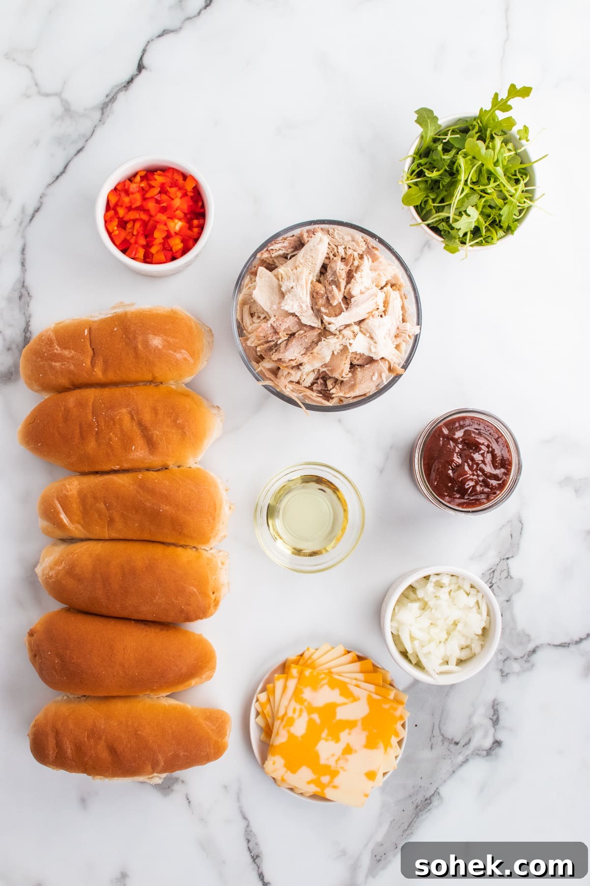 Ingredients for sandwich: hoagie rolls, chopped smoked turkey, BBQ sauce, diced red pepper, onion, arugula.