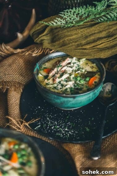 Two bowls of soup on a table.