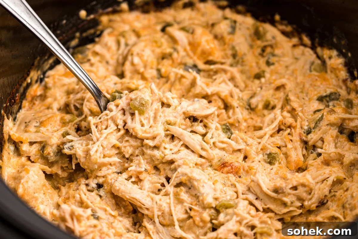 Slow Cooker Jalapeño Popper Chicken Recipe 6 side view of chicken with cheese and jalapenos.