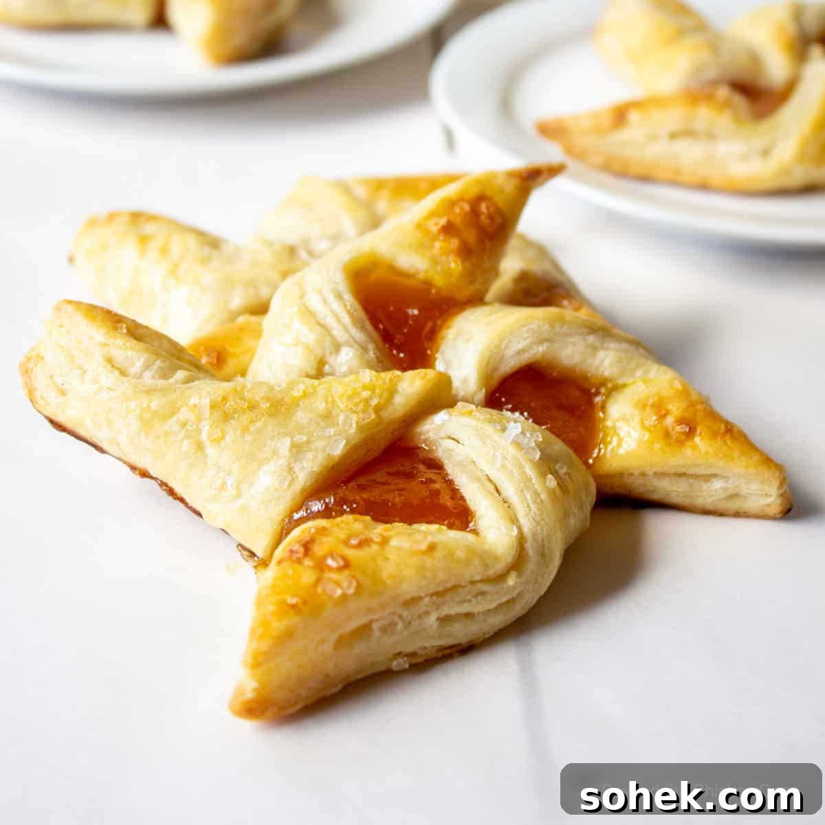 Savory and Sweet Puff Pastry Pinwheels: Quick Party Appetizers 2 A pinwheel pastry filled with apricot jam.