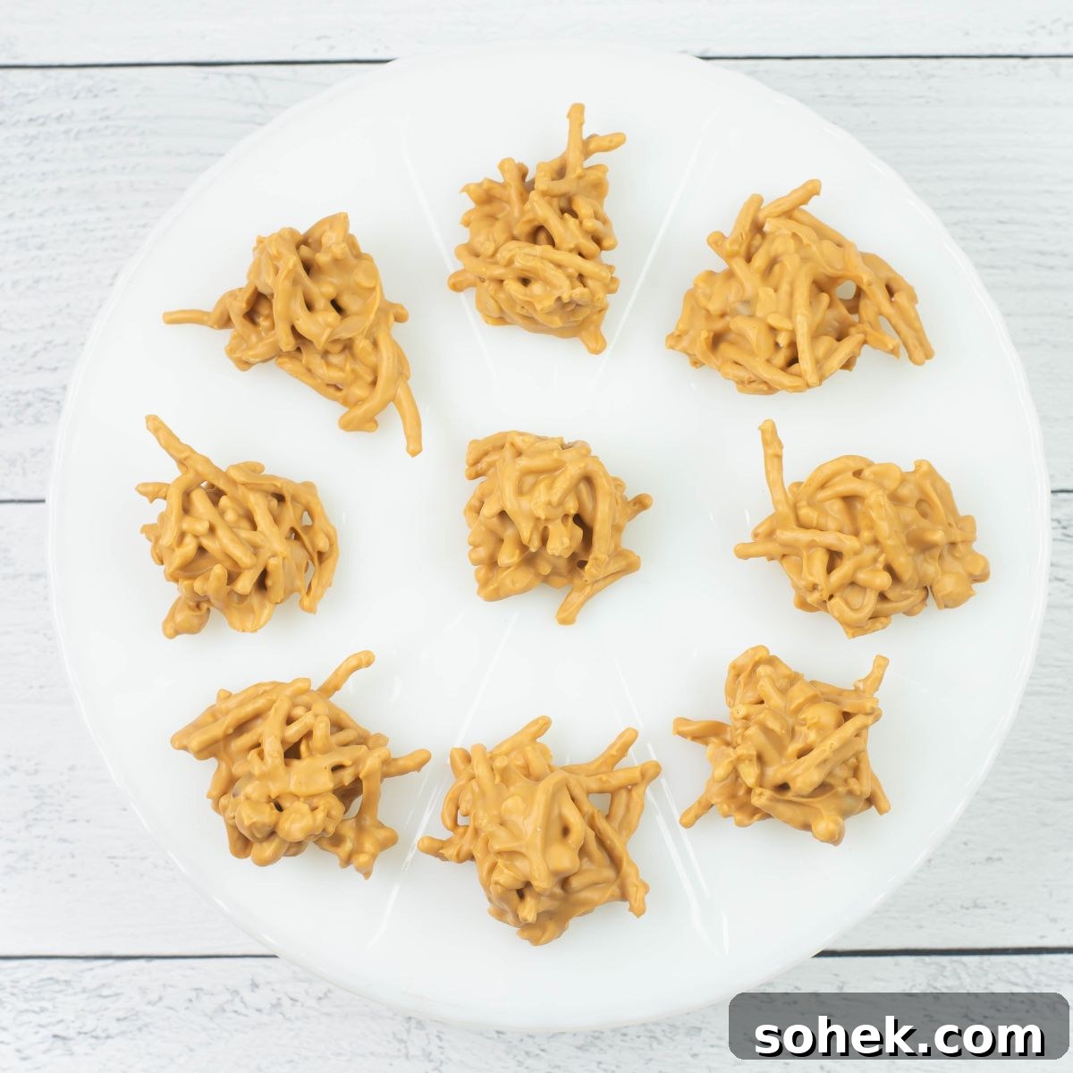 No-Bake Peanut Butter Haystack Cookies Recipe 13 Chow Mein Haystacks on a milk glass cake stand.