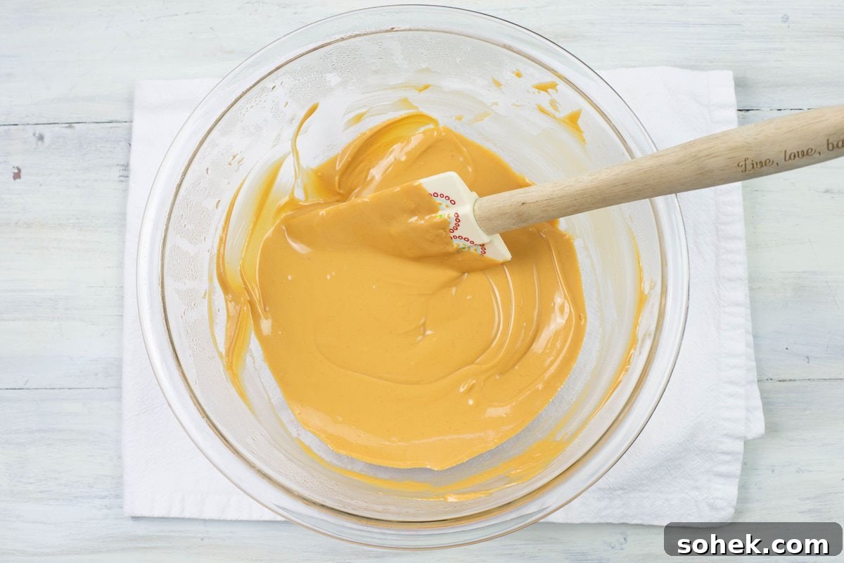 No-Bake Peanut Butter Haystack Cookies Recipe 5 Creamy melted butterscotch chips and peanut butter in a bowl.