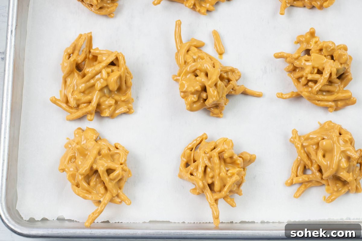 No-Bake Peanut Butter Haystack Cookies Recipe 9 The cookies on a tray to harden.