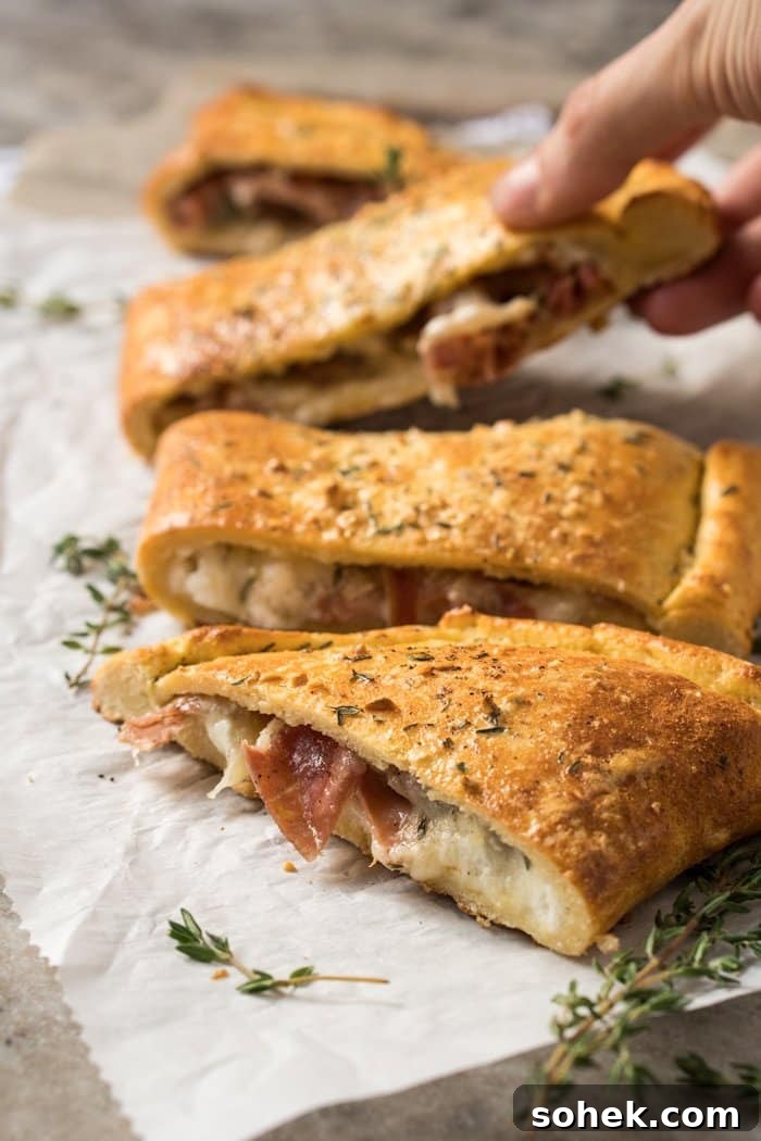30-Minute Keto Calzones: Gluten-Free, Dairy-Free Pizza Turnovers 7 Taking a slice of the keto calzone