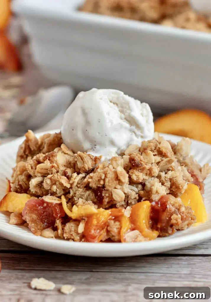 Gluten-Free Dairy-Free Peach Cupcakes: Moist Summer Dessert 8 A golden peach crisp topped with caramelized oat topping, juicy peaches on the bottom, and a scoop of vanilla ice cream.