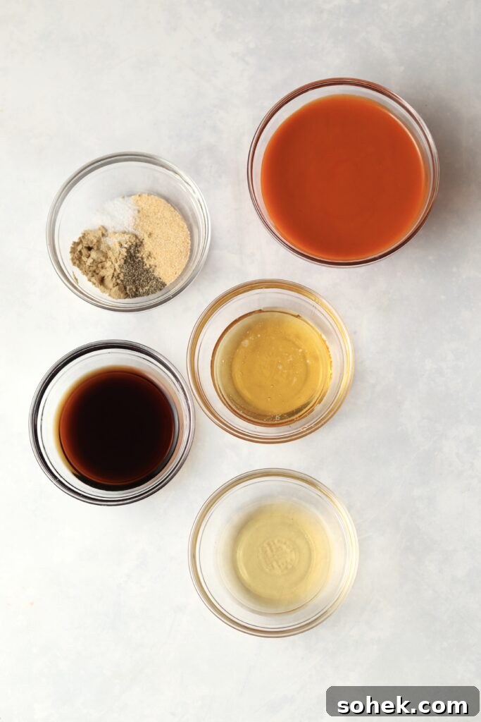 Spicy Firecracker Ground Chicken Recipe for Weeknight Meals 4 buffalo sauce, honey, soy sauce, and spices in prep bowls