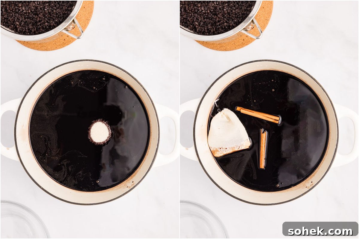 sugar, cinnamon, and tea bag of cloves added to pot of elderberry liquid.