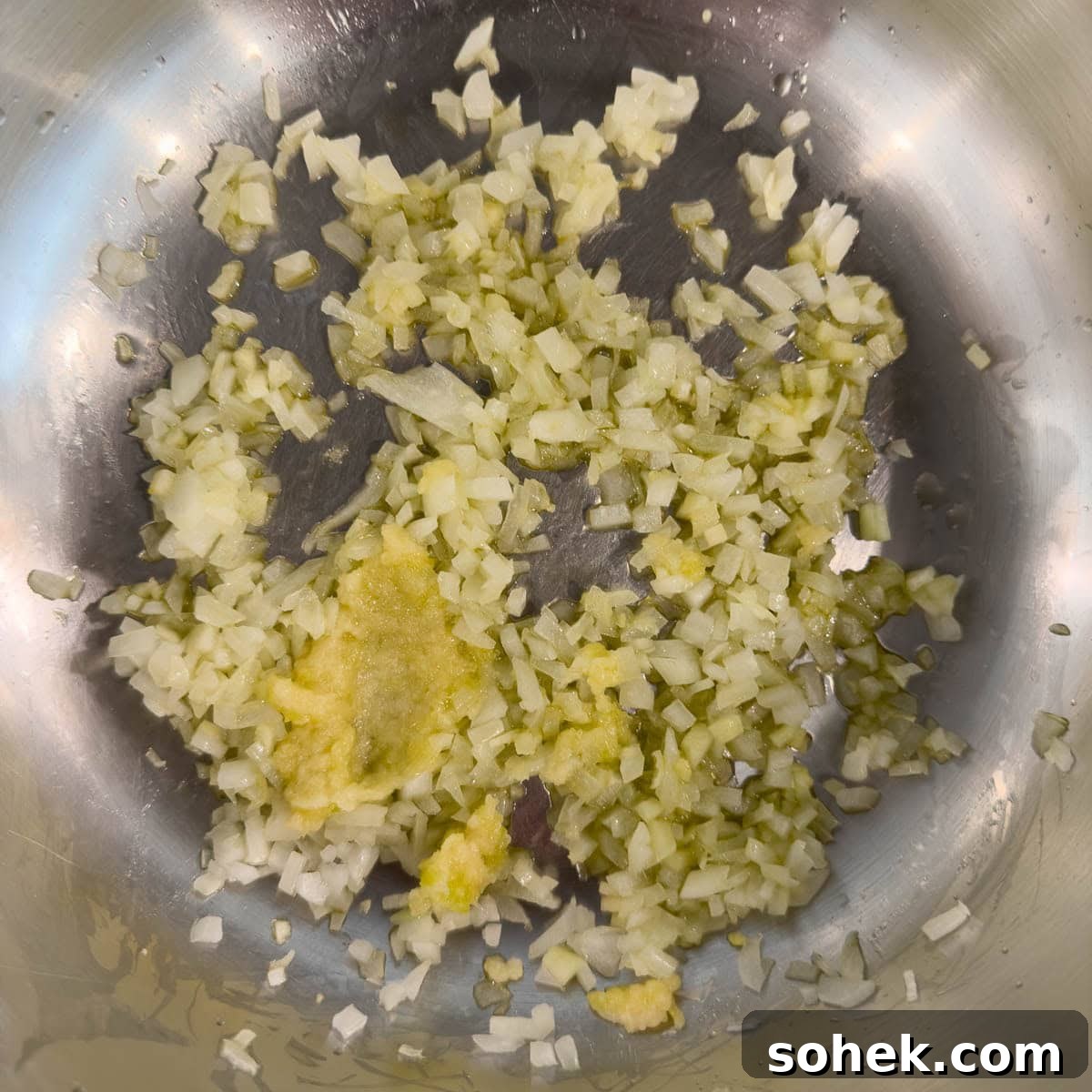 Slow Cooker Shredded Beef Recipe for Sandwiches and Tacos 4 Sauteing chopped onion and garlic until soft in a pan on the stovetop.
