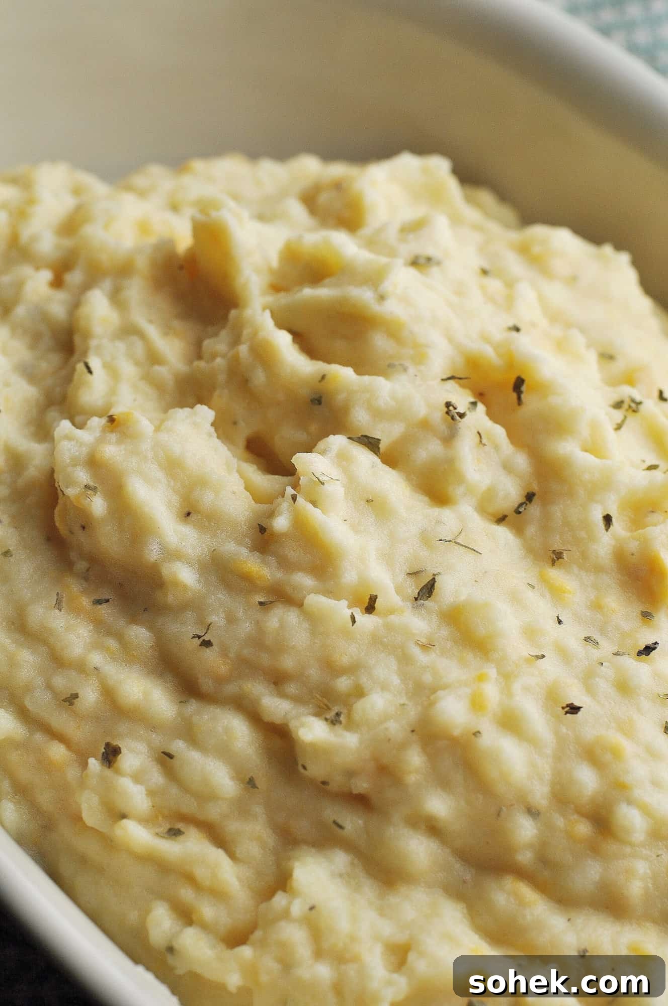 Serving of mashed potatoes topped with cheese