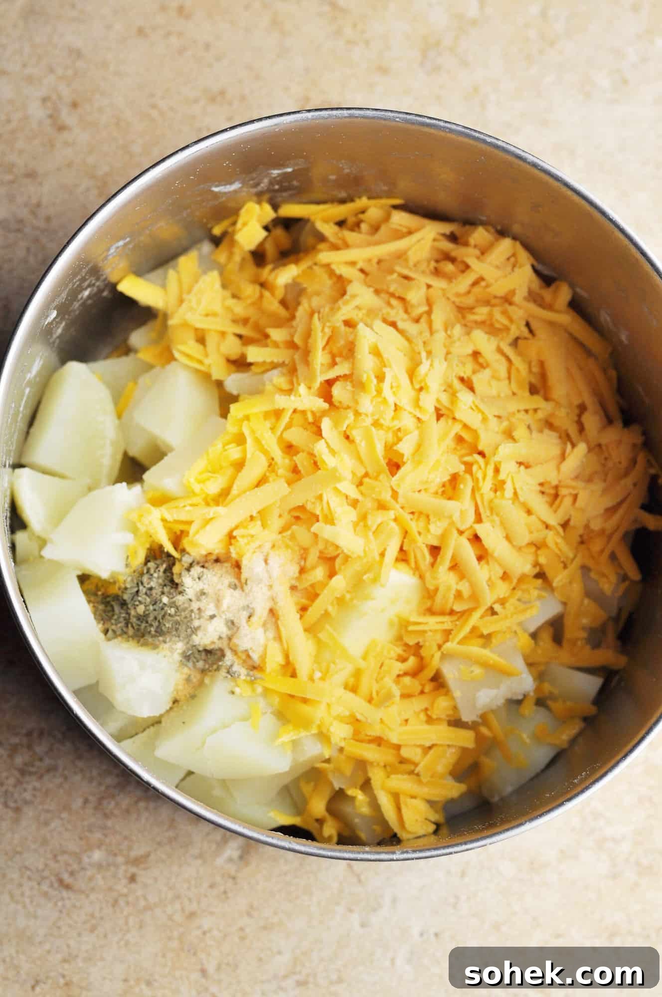 Cooked potatoes with cheese and seasonings