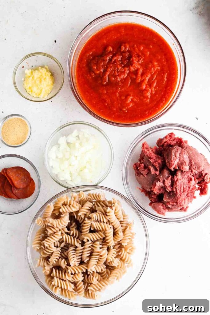 paleo pizza casserole 1 pizza casserole ingredients in bowls laid out